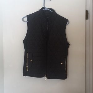 Black quilted vest with gold details